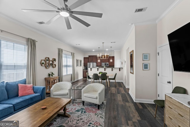 309 E 41st St, Savannah, GA 31401 - living area with ceiling fan, dark wood-type flooring, crown molding, and a chandelier