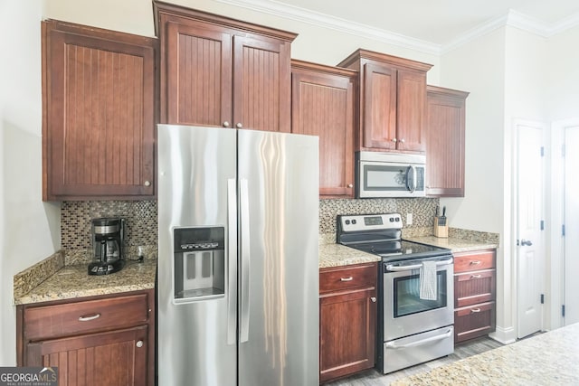 309 E 41st St, Savannah, GA 31401 - kitchen featuring stainless steel appliances, backsplash, light wood finished floors, ornamental molding, and light stone counters