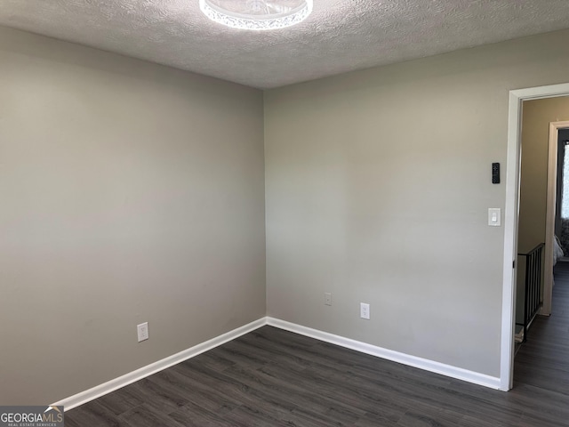 501 Carlton Rd Unit 3-D, Palmetto, GA 30268 - spare room with dark wood-type flooring and a textured ceiling