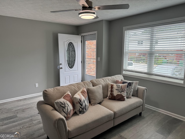 501 Carlton Rd Unit 3-D, Palmetto, GA 30268 - living area featuring a ceiling fan, a textured ceiling, and wood finished floors