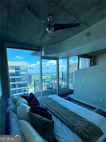 400 Peachtree St Unit 3412, Atlanta, GA 30308 - bedroom with access to exterior and a ceiling fan