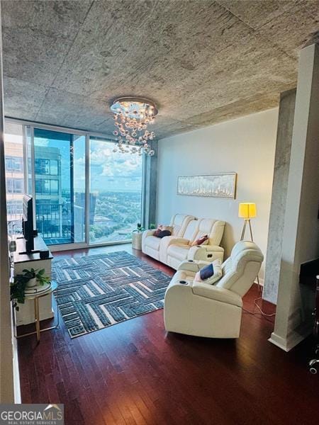 400 Peachtree St Unit 3412, Atlanta, GA 30308 - living room with wood finished floors, a wall of windows, and a chandelier