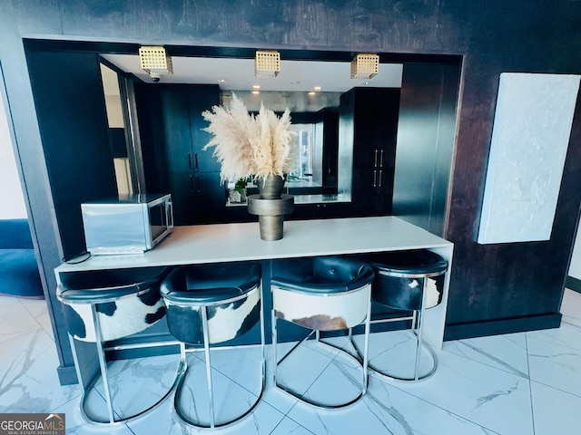 400 Peachtree St Unit 3412, Atlanta, GA 30308 - dining area featuring marble look tiles