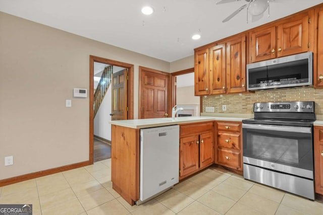 4211 Burnt Hickory Rd NW, Marietta, GA 30064 - kitchen featuring appliances with stainless steel finishes, tasteful backsplash, light countertops, and recessed lighting