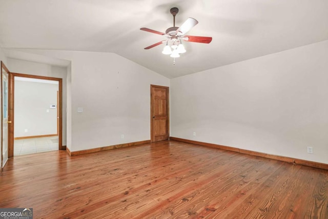 4211 Burnt Hickory Rd NW, Marietta, GA 30064 - unfurnished room with vaulted ceiling, a ceiling fan, and light wood-type flooring