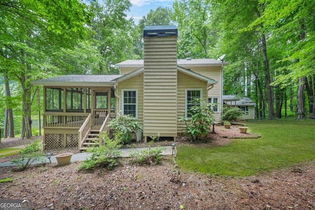 4211 Burnt Hickory Rd NW, Marietta, GA 30064 - rear view of house with a sunroom, a chimney, a yard, and roof with shingles