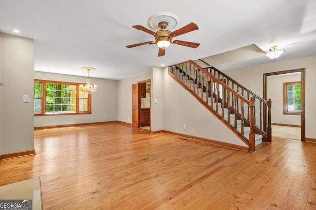 4211 Burnt Hickory Rd NW, Marietta, GA 30064 - unfurnished living room with light wood-style floors, a chandelier, a ceiling fan, stairs, and recessed lighting