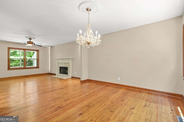 4211 Burnt Hickory Rd NW, Marietta, GA 30064 - unfurnished living room featuring light wood-style flooring, a chandelier, a high end fireplace, and a ceiling fan
