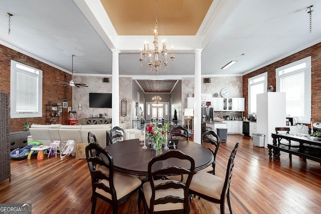 113 N Jefferson Ave, Eatonton, GA 31024 - dining area featuring decorative columns, plenty of natural light, a chandelier, and ornamental molding