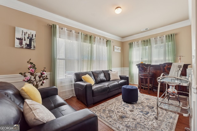 2629 Muskeg Ct SW, Atlanta, GA 30331 - living room featuring healthy amount of natural light, crown molding, a wainscoted wall, and wood finished floors