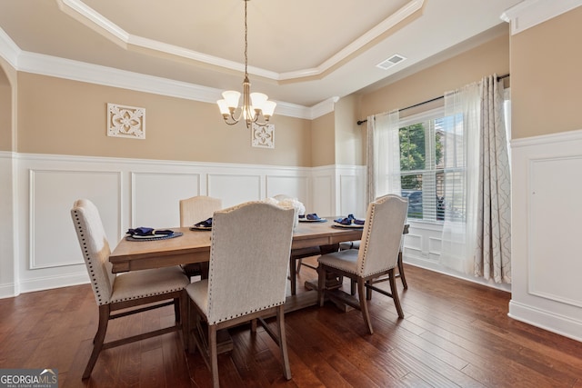 2629 Muskeg Ct SW, Atlanta, GA 30331 - dining room with a tray ceiling, a decorative wall, a chandelier, crown molding, and a wainscoted wall