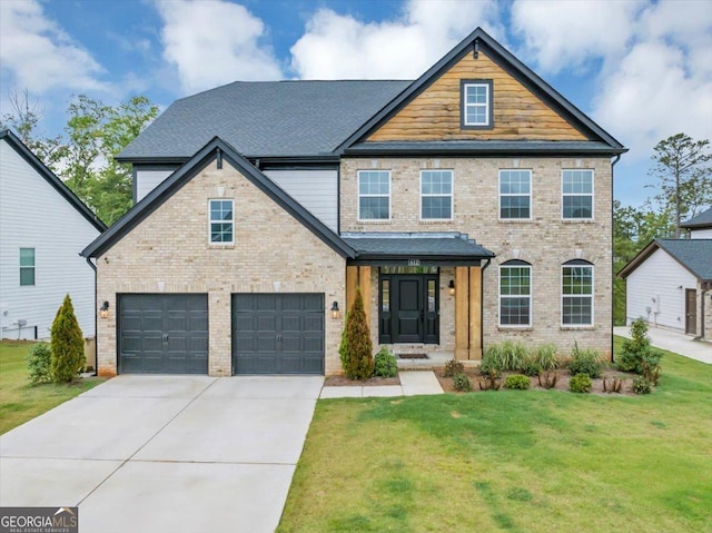 612 Michigan Cir, Hoschton, GA 30548 - view of front of house with a front lawn, driveway, an attached garage, and brick siding
