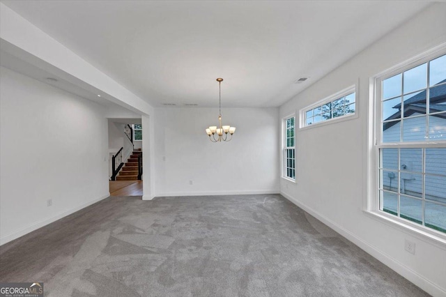 612 Michigan Cir, Hoschton, GA 30548 - unfurnished dining area with stairway, a chandelier, and carpet