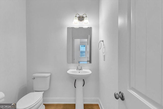 612 Michigan Cir, Hoschton, GA 30548 - bathroom featuring toilet and baseboards