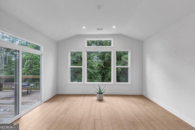 612 Michigan Cir, Hoschton, GA 30548 - interior space featuring plenty of natural light, vaulted ceiling, and light wood-style floors