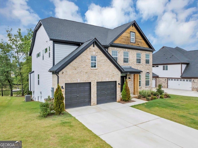 612 Michigan Cir, Hoschton, GA 30548 - craftsman-style house featuring a garage, driveway, a front yard, and brick siding