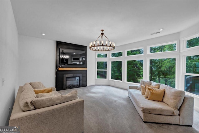 612 Michigan Cir, Hoschton, GA 30548 - living room featuring a large fireplace, carpet floors, a chandelier, and recessed lighting