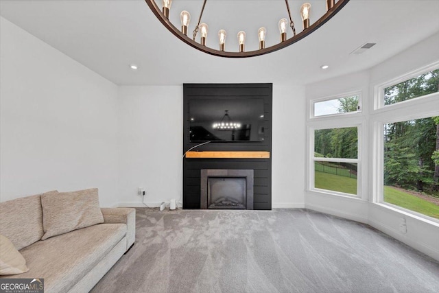 612 Michigan Cir, Hoschton, GA 30548 - unfurnished living room featuring carpet, a fireplace, and recessed lighting