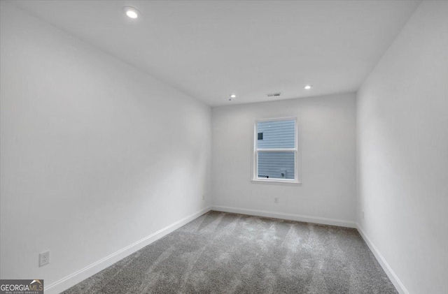 612 Michigan Cir, Hoschton, GA 30548 - carpeted empty room featuring recessed lighting