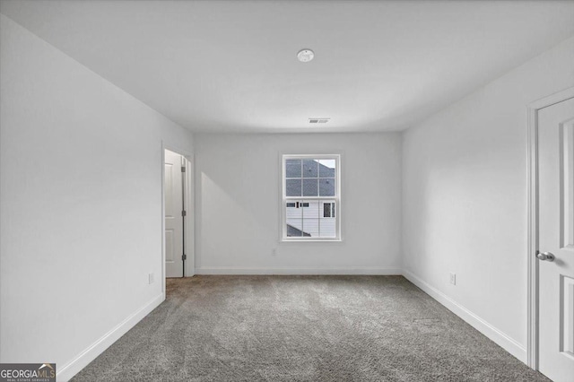 612 Michigan Cir, Hoschton, GA 30548 - empty room featuring carpet flooring and baseboards