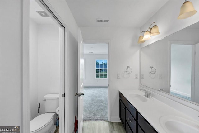 612 Michigan Cir, Hoschton, GA 30548 - bathroom with wood finished floors and double vanity