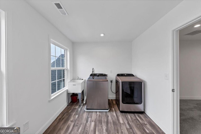 612 Michigan Cir, Hoschton, GA 30548 - laundry room featuring washer and clothes dryer, wood finished floors, and recessed lighting