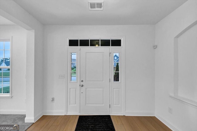 612 Michigan Cir, Hoschton, GA 30548 - foyer featuring hardwood / wood-style floors and baseboards