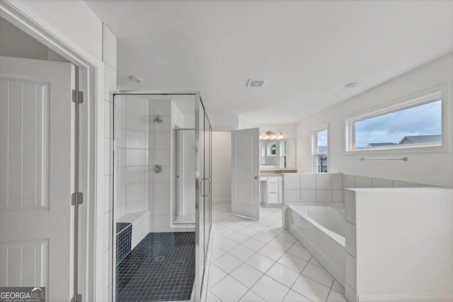 612 Michigan Cir, Hoschton, GA 30548 - bathroom with a stall shower, a garden tub, and tile patterned flooring