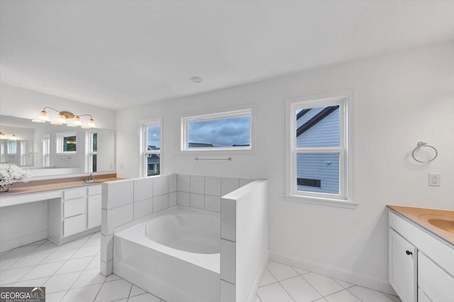 612 Michigan Cir, Hoschton, GA 30548 - bathroom with vanity, a garden tub, plenty of natural light, and tile patterned flooring