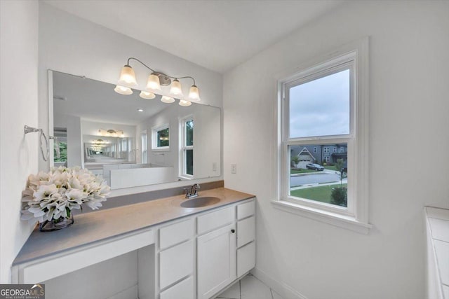 612 Michigan Cir, Hoschton, GA 30548 - bathroom with vanity and baseboards