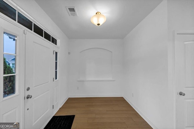 612 Michigan Cir, Hoschton, GA 30548 - foyer with dark wood-style floors and baseboards