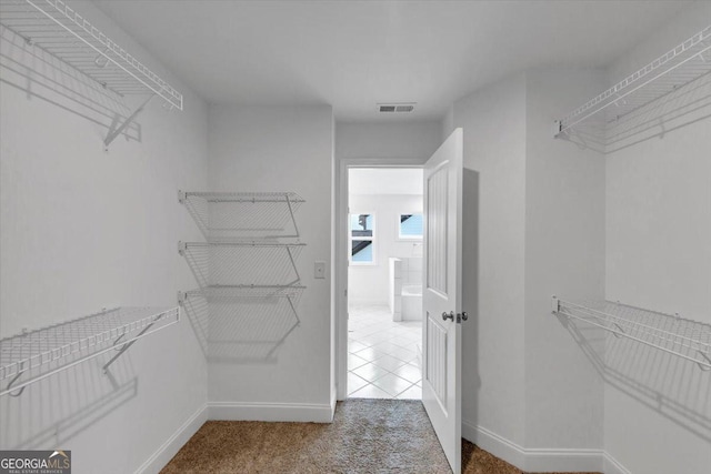 612 Michigan Cir, Hoschton, GA 30548 - spacious closet with carpet floors