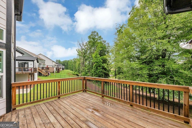 612 Michigan Cir, Hoschton, GA 30548 - wooden deck featuring a lawn