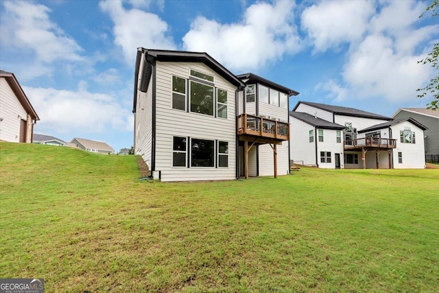 612 Michigan Cir, Hoschton, GA 30548 - rear view of property with a lawn and a deck