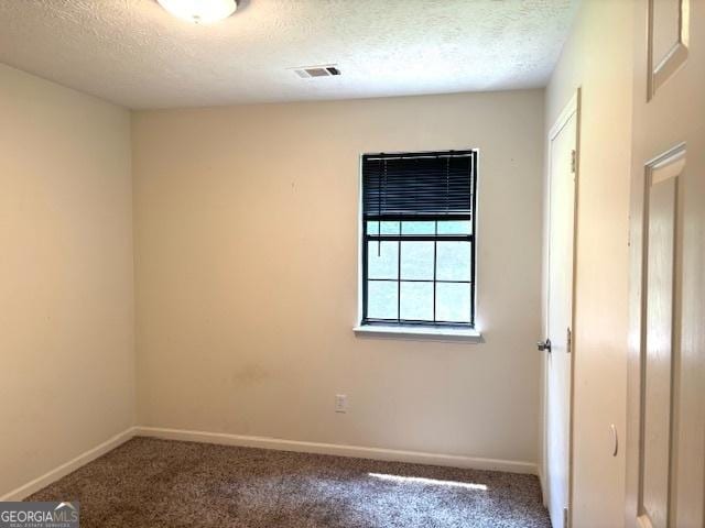 7813 Sugarland Dr, Jonesboro, GA 30236 - empty room with carpet and a textured ceiling