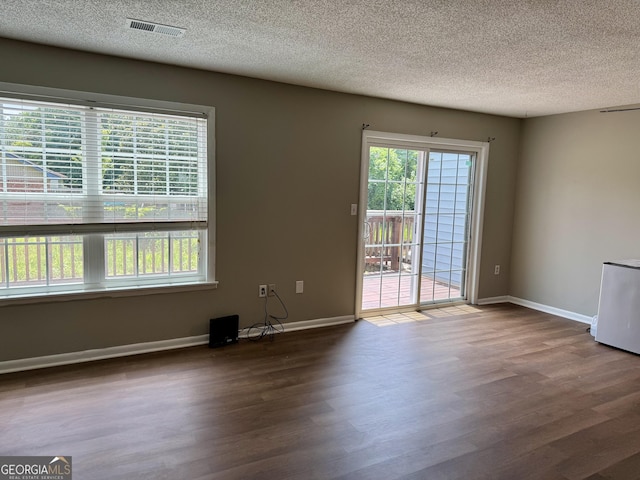 912 Pineland Ave Apt 50, Hinesville, GA 31313 - spare room with wood finished floors and a textured ceiling
