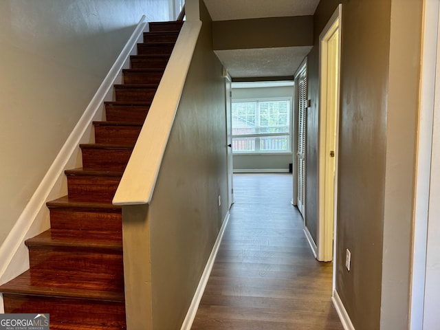 912 Pineland Ave Apt 50, Hinesville, GA 31313 - stairway with wood finished floors and a textured ceiling