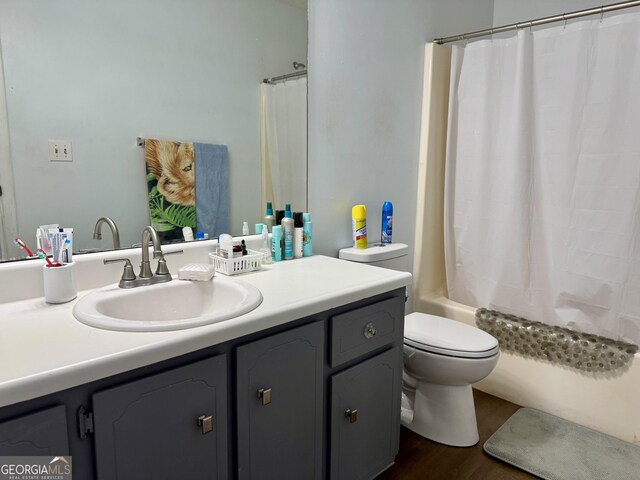 912 Pineland Ave Apt 50, Hinesville, GA 31313 - bathroom with vanity, shower / bathtub combination with curtain, and wood finished floors