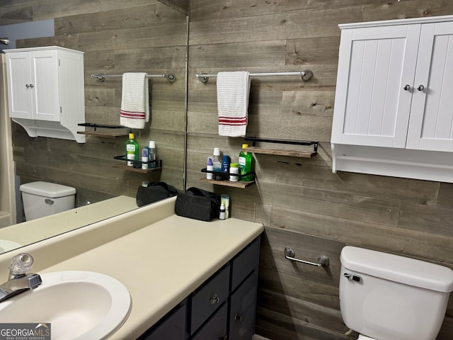 912 Pineland Ave Apt 50, Hinesville, GA 31313 - bathroom with vanity and wooden walls