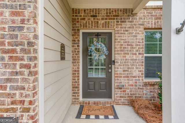 6841 Lancaster Xing, Flowery Branch, GA 30542 - view of exterior entry featuring brick siding