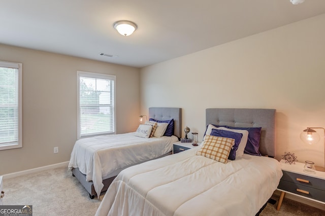 6841 Lancaster Xing, Flowery Branch, GA 30542 - carpeted bedroom featuring baseboards