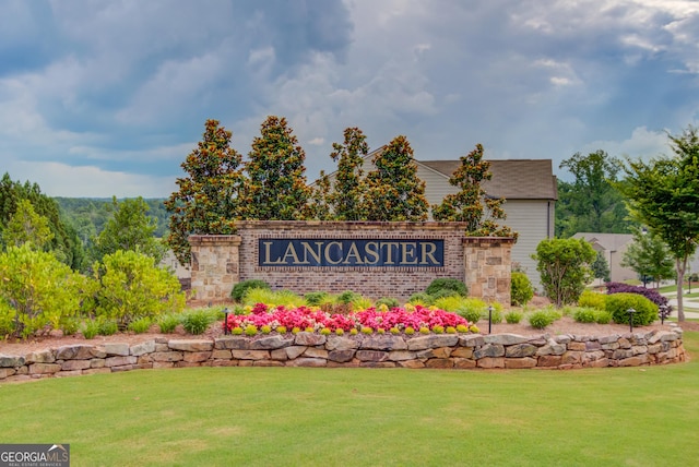 6841 Lancaster Xing, Flowery Branch, GA 30542 - community / neighborhood sign featuring a lawn