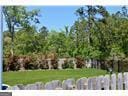 1 Egrets Landing Ct, Savannah, GA 31419 - view of green lawn featuring a garden