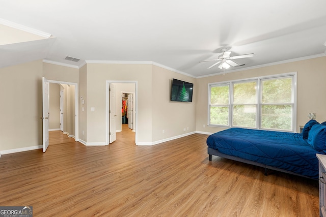 733 Miller Run, Atlanta, GA 30349 - bedroom with light wood-style flooring, ornamental molding, ceiling fan, and a spacious closet