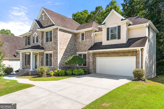 733 Miller Run, Atlanta, GA 30349 - view of front of property with driveway, an attached garage, a front yard, and brick siding
