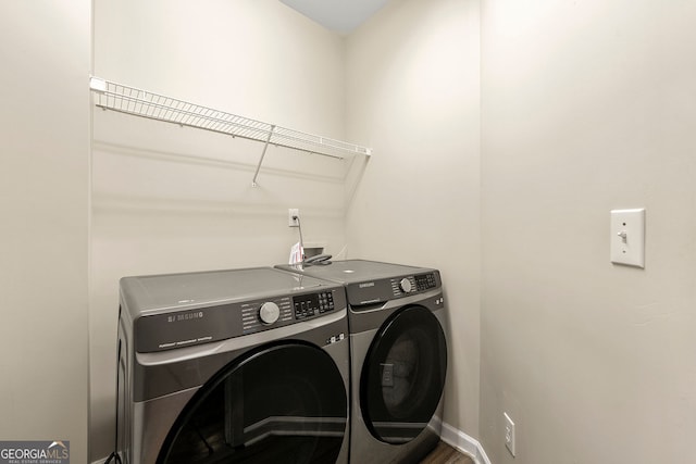 733 Miller Run, Atlanta, GA 30349 - washroom featuring washer and dryer and baseboards