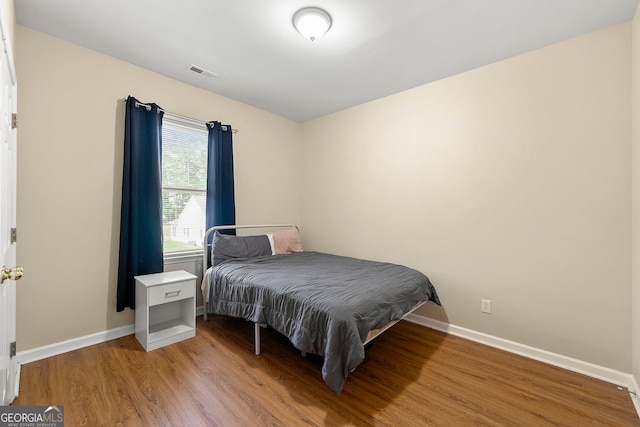 733 Miller Run, Atlanta, GA 30349 - bedroom with wood finished floors and baseboards