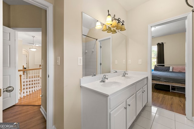 733 Miller Run, Atlanta, GA 30349 - ensuite bathroom featuring double vanity, tile patterned floors, and a shower