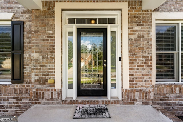 733 Miller Run, Atlanta, GA 30349 - doorway to property featuring brick siding