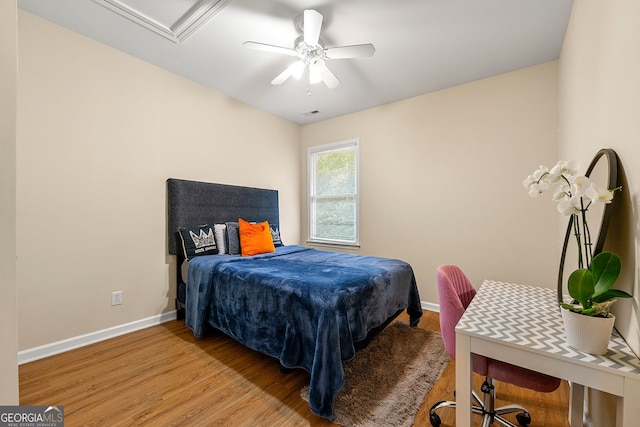 733 Miller Run, Atlanta, GA 30349 - bedroom featuring light wood-type flooring and a ceiling fan